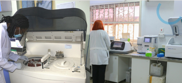 Laboratory scientist working with clinical analysers at St. Andrew Hospital